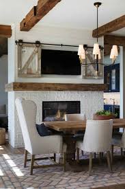 It already had beautiful wood ceiling beams, a gas fireplace and three big windows for tons of sunlight. Classic Lakeside Home In Minnesota Features Modern Farmhouse Elements Farmhouse Style Dining Room Cottage Dining Rooms Dining Room Fireplace