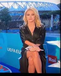She has been active on rai since the 1990s, hosting its main sports programs such as la domenica sportiva and 90º minuto. Euro 2020 Presenter Paola Ferrari Goes Viral With Sharon Stone Leg Crossing Moment But Denies Not Wearing Underwear Uk News Agency