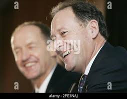 Australia's Commonwealth Bank chairman John Schubert, left, and Ralph  Norris laugh during a press conference announcing that Norris will take  over as CEO, in Sydney Tuesday, June 14, 2005. Schubert praised Norris'