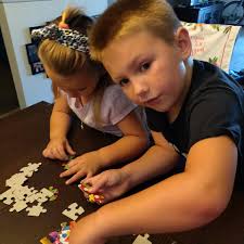 who worked jigsaw puzzles, with parents or grandparents?