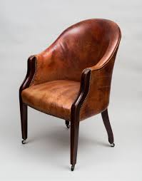 An Edwardian Mahogany Framed Tub Chair Upholstered In A Reddish Brown Colored Leather With Brass Nail Heads A Wrap Around B Leather Tub Chairs Tub Chair Chair