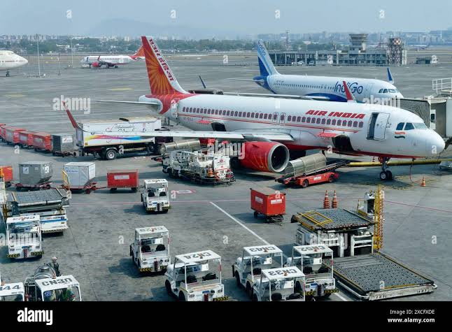 An Air India passenger aircraft parked on the tarmac at an international airport.