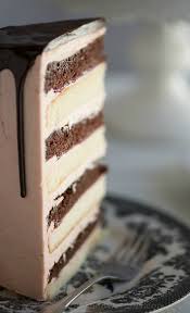 Chocolate Vanilla Tuxedo Cake With Rasperry Buttercream Recipe Tuxedo Cake Chocolate And Vanilla Cake White Chocolate Buttercream