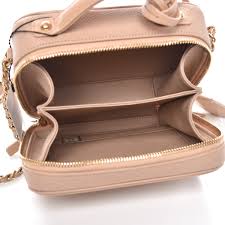 Chanel did a modernized take on the silhouette of the vanity bag comes in solid beige, black and silver and also a beige/black combination. Chanel Caviar Quilted Small Cc Filigree Vanity Case Beige 239968 Fashionphile