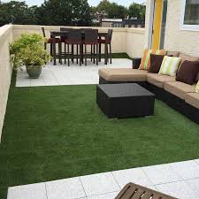 Once the grass is installed, brush it out to create a cohesive, natural look. Artificial Grass Turf Tile Artificial Turf Grass Turf Tile Outdoor Flooring Options Outdoor Deck Tiles Turf Patio