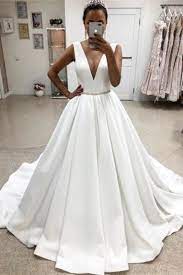 The full length dress finishes with a dramatic court train. Elegant Deep V Neck Simple Ball Gown Wedding Dresses Bridal Dresses Ball Gown Wedding Dress Wedding Dresses White Ball Gowns
