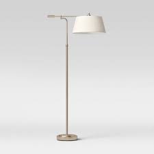 As elegant as it is useful, this metal floor lamp features a white shade and stand that beautifully blend with any home decor style. Brass Floor Lamps Standing Lamps Target