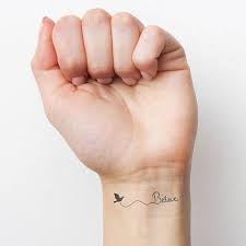 40 Charming One Word Tattoo Examples Wrist Tattoos For Women Small Wrist Tattoos Believe Tattoos