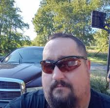 Who is the guy in the clown mask driving around?