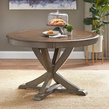 An antique rustic table and white modern chairs plus a bench for a cozy dining space. Simple Living Vintner Country Style Round Dining Table On Sale Overstock 12378388