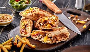 Spread 1 teaspoon of our garlic paste along the diameter of a pita bread, add some salted cucumber pickles, french fries, grilled tomatoes or peppers (optional), the grilled chicken shish tawook, roll as in a burrito and enjoy. A La Decouverte Du Shawarma Le Kebab Libanais Qui A Seduit Le Monde