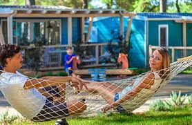 The policeman is seen accepting a. Family And Children Camping Lanterna Porec Croatia