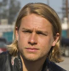 To do a pompadour rockabilly hairstyle, use a pomade styling product, a comb with thick and thin teeth and hairspray. Charlie Hunnam Rock N Roll Hairstyle With Long Side Bangs With Spiky Hair On At The