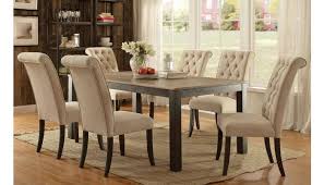 A typical transitional dining table set offers a glass top, pedestal base and simple sleek lines. Jayar Transitional Dining Table Set