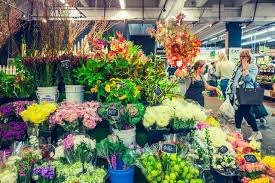 Rows of neatly arranged fruit, vegetables and flowers splash yellows, greens and reds along the entire perimeter, where the whole neighbourhood gathers for saturday feasts. Flower Shop At South Melbourne Market Photo By Sewon Park On Eyeem Melbourne Markets Flowers Royalty Free Pictures