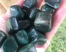 If you have warm undertones, green usually looks great. Dark Green Stone Etsy
