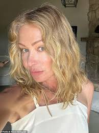Portia de Rossi, 50, debuts wavy new hairstyle as she declares 'I'm  bringing the perm back!' and shares hilarious rollers snap