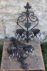 The amber glass shades are patterned with the same curves and flourishes you see on the wrought iron bronze umber frames. Vintage Light Sconces Wall Mount Reading Lamps
