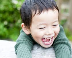 Preschooler waits patiently to go down slide