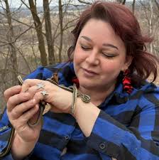 The adorable moment a bird made itself comfortable in an older man's lap  was captured