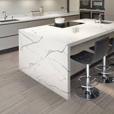 Photo Features One Quartz Surfaces In Statuary Quartz On The Counter And Daltile Marble In Silver Screen 1 White Concrete Countertops Daltile Top Kitchen Table