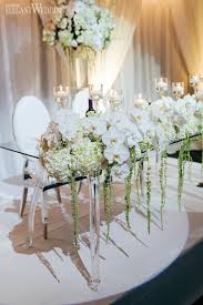 Traditional White Wedding With Silver Details Elegantwedding Ca Flower Centerpieces Wedding White Orchids Wedding Orchid Centerpieces Wedding