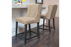 Sporting A Sumptuous Wingback Design With A Sheltering Feel And Lovely Flow Moriann C Ashley Furniture Dining Ashley Furniture Living Room Dining Room Remodel