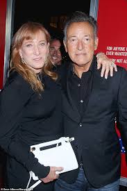 Sam poses with father bruce springsteen, mother patti scialfa and brother evan, far right, as well as city. Bruce Springsteen And Wife Patti Scialfa Match In Black At Blinded By The Light Premiere Daily Mail Online