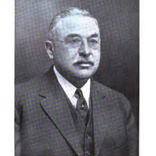 John Schmidt, born in Germany in 1856, began working in the mercantile  business upon adulthood. He relocated to New York and later Texas with his  friend, Abraham Mayer. Together, in 1878, they