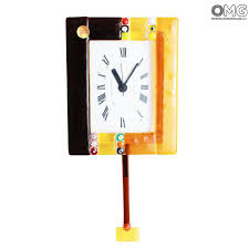 The pendulum and top curve design feature golden highlights for beauty. Pendulum Wall Clock Murrina Orange Black Small