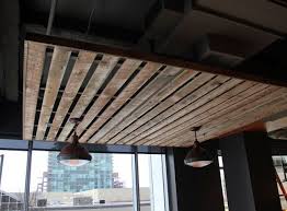 Interior Palette Lighting Looks Rad And Makes You Feel Cozy Sitting Underneath It Creates A Nook Vibe Reclaimed Wood Ceiling Attic Rooms Attic Flooring