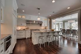 You can match the cabinetry and kitchen island like in this photo for a sleek and subtle design. 2013 Parade Of Homes Dream Home Edina Mn American Traditional Kitchen Minneapolis By Spacecrafting Architectural Photography Houzz