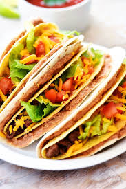 Double Decker Tacos Start With A Flour Tortilla Layered With Beans Then Inside There S A Crispy Beef Taco Filled Wi Tacos Beef Tacos Double Decker Taco Recipe