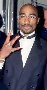 We used to feel so trapped in the struggle until God gave us 2Pac and 2Pac  gave us strength, courage and more with his words. We will never forget you  Tupac Shakur