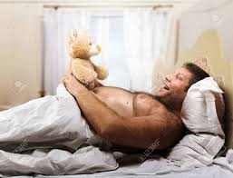 Maybe you would like to learn more about one of these? Adult Man In Bed Looks At Toy Bear In Home Interior Stock Photo Picture And Royalty Free Image Image 34140476