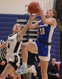 Webster Schroeder runs past Pittsford Sutherland in girls basketball