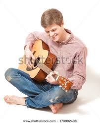 Smiling Man Sitting On Floor And Playing On Acoustic Guitar Stock Photo Body Reference Poses Pose Reference Photo Man Sitting Not only do some guitarists sit with the guitar in a totally wrong position a lot of the time, they also constantly change how they sit with the guitar, often without realising it. smiling man sitting on floor and