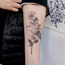The tattoo on the lower arm represents a little flying bird with an olive branch in its beak and the inscription faith hope love. Top 61 Best Small Bird Tattoo Ideas 2021 Inspiration Guide