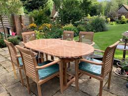 Eat in the great outdoors of your backyard with this dining set from the noble house outdoor furniture assortment. Teak Garden Dining Table Plus 8 Chairs Cushions And Parasol