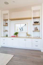 Custom Built In With White Oak Shelves Transitional Living Room Design Built In Shelves Living Room Living Room Cabinets