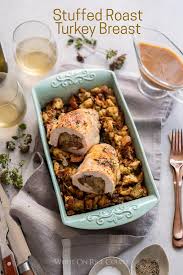 Bring to a simmer, then cook for 10 minutes or until reduced by half. Stuffed Roast Turkey Breast With Sausage Stuffing White On Rice Couple