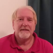 Old metal shovel with wooden handle. Has rust spots and is worn out.