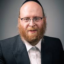 My grandfather Chief Rabbi David Moshe Lieberman of Antwerp is being helped  last night by Chief Rabbi Aaron Schiff of Machsike Hadass Antwerp.