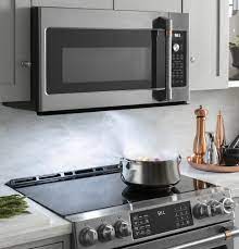 A microwave oven that is installed directly above the stove. Cafe 2 1 Cu Ft Over The Range Microwave Oven Cvm521p2ms1 Cafe Appliances