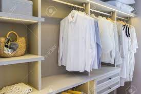 They're great as they provide extra hanging space. Modern Wooden Wardrobe With Clothes Hanging On Rail In Walk In Stock Photo Picture And Royalty Free Image Image 97299477
