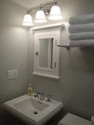 Bathroom light above mirror cabinet. Lighting Over Surface Mounted Medicine Cabinet Bathrooms Forum Gardenweb Surface Mount Medicine Cabinet Medicine Cabinet Mirror Lighted Medicine Cabinet