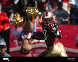 San Francisco 49ers' Fred Amey (18) celebrates a punt returned for a  touchdown against the St. Louis Rams at Monster Stadium in San Francisco