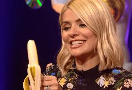 Holly Willoughby eats a banana very seductively beside Olly Murs and Will  Mellor