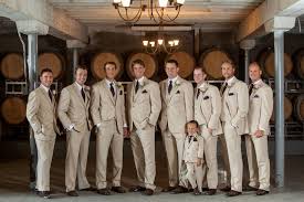 Indoor church or marriage hall weddings can be suitable for the groomsmen to be dressed in suits. Beige Suits With Brown Ties