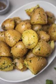 Gently toss the potatoes with the butter, 1 teaspoon kosher salt, the pepper, the garlic powder, and. Buttery Boiled Potatoes Recipe With Fresh Herbs The Dinner Bite